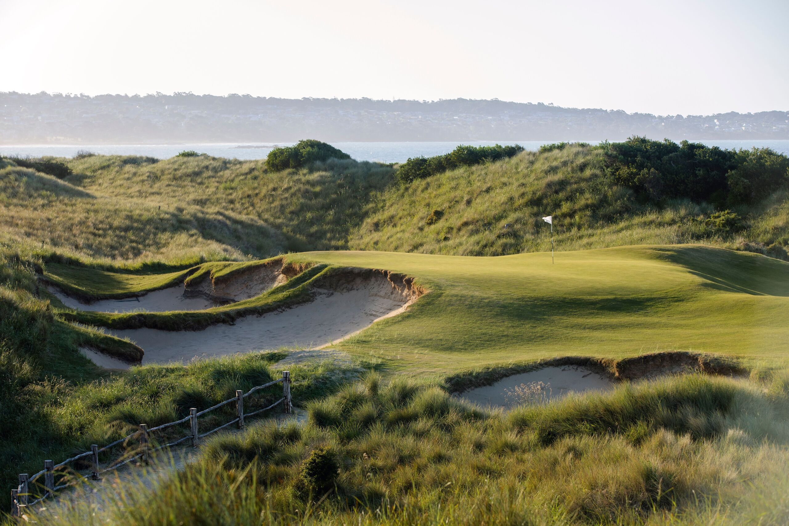 A links green framed by coastal dunes on a Tasmanian golf course