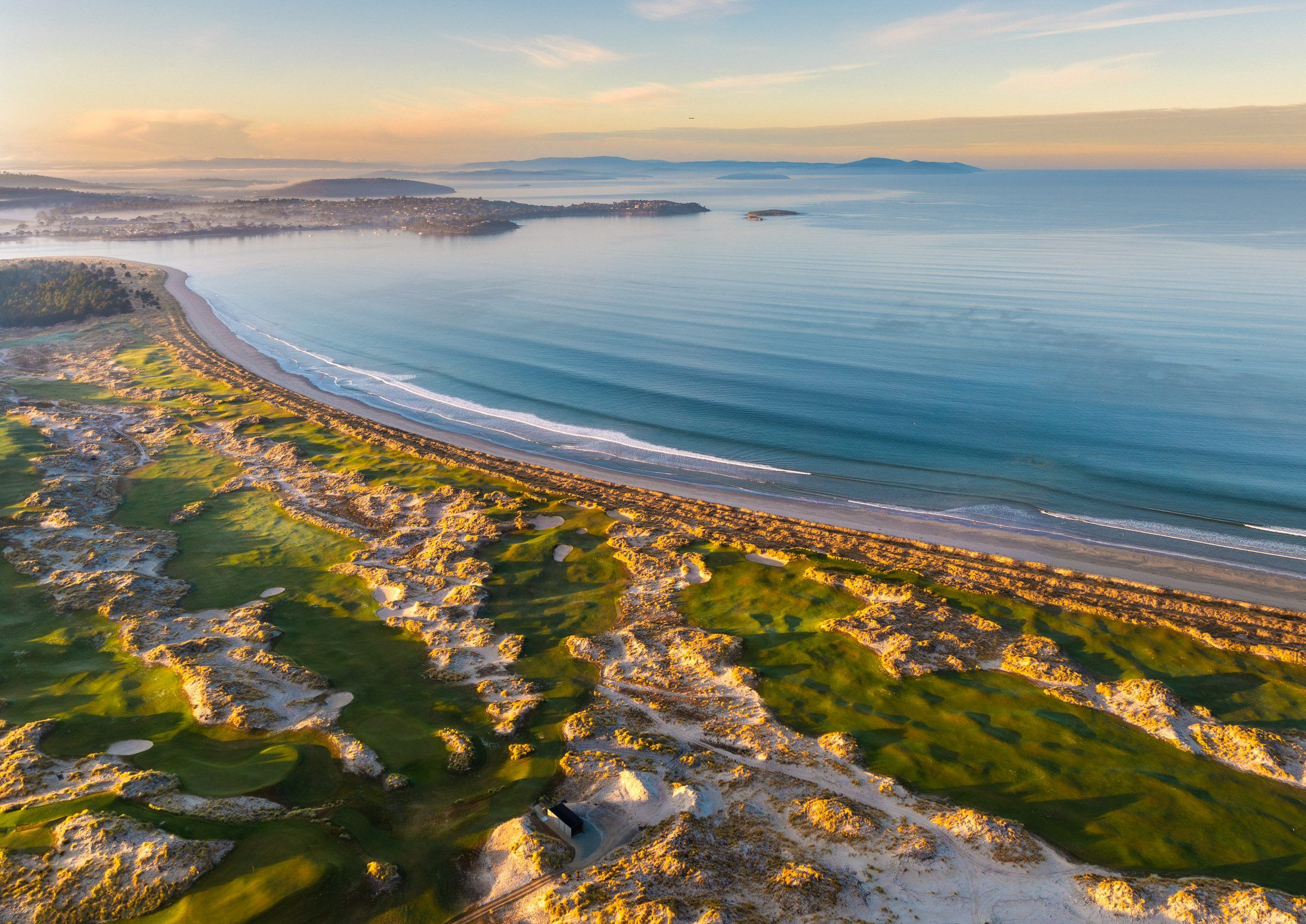 Aerial view of Seven Mile Beach golf course and coastline