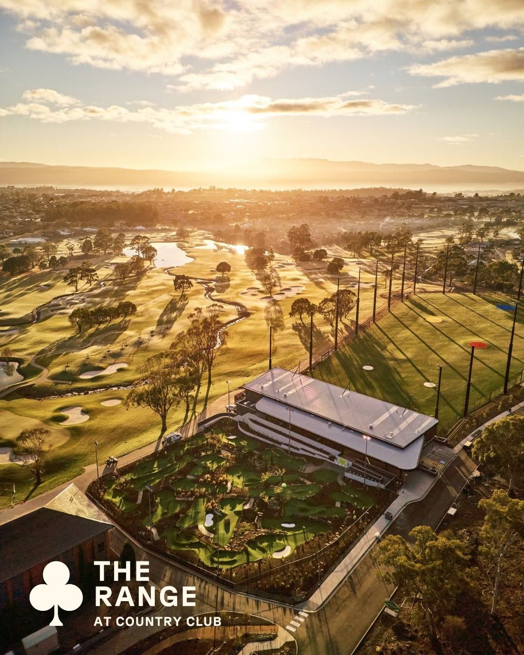 Aerial view of The Range driving range and mini golf at Country Club Tasmania at sunrise